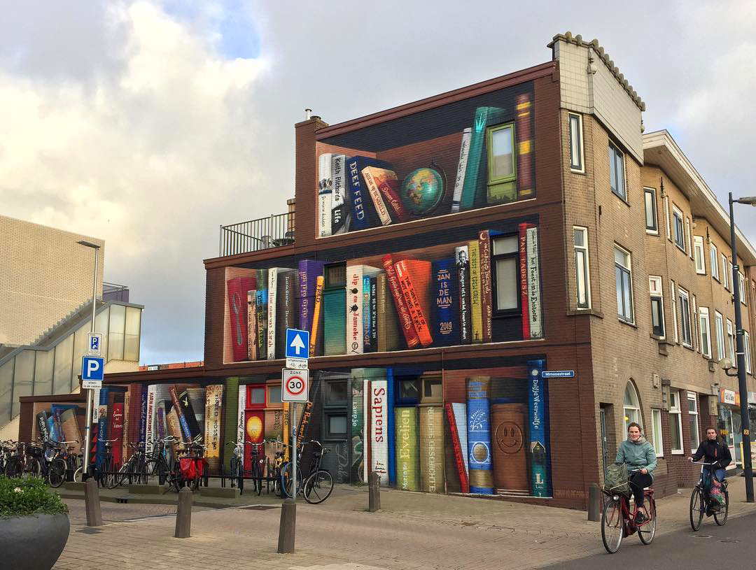 Street Art for Book Lovers Dutch Artists Paint Massive Bookcase Mural