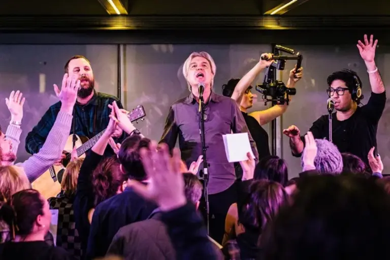 Watch David Byrne Lead a Massive Choir in Singing David Bowie’s “Heroes”