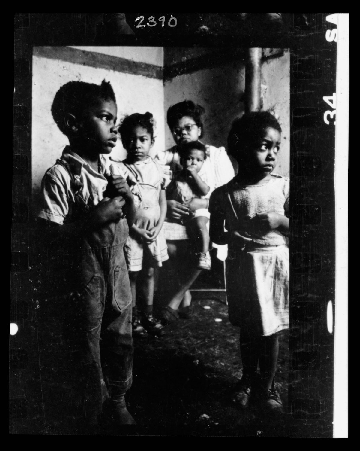 African American mother and her four children in their tenement apartment